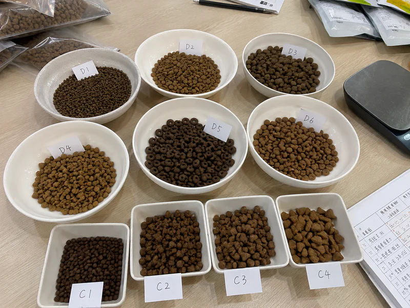 Close-up of dry pet food kibble shapes and coating